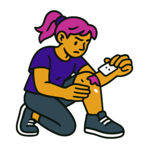 Bold vector-style cartoon of a woman kneeling to clean a fresh wound on her leg with a bandage pad. She wears an indigo shirt and has magenta hair tied back in a ponytail, with a focused expression. The image uses solid colors of gold, purple, pink, and black with thick outlines in a flat street-art style.