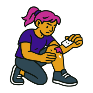 Bold vector-style cartoon of a woman kneeling to clean a fresh wound on her leg with a bandage pad. She wears an indigo shirt and has magenta hair tied back in a ponytail, with a focused expression. The image uses solid colors of gold, purple, pink, and black with thick outlines in a flat street-art style.